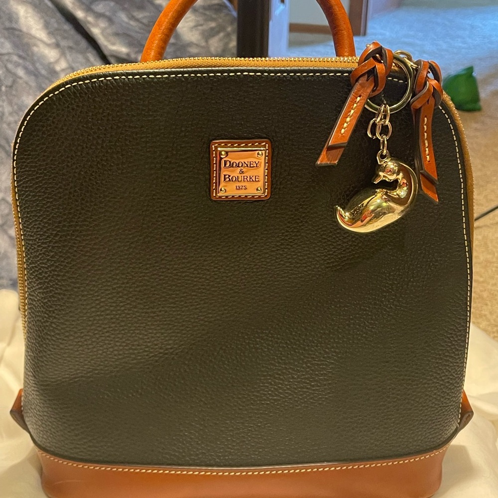 Dooney and Bourke Pod Backpack. Carried on a few times on vacation.